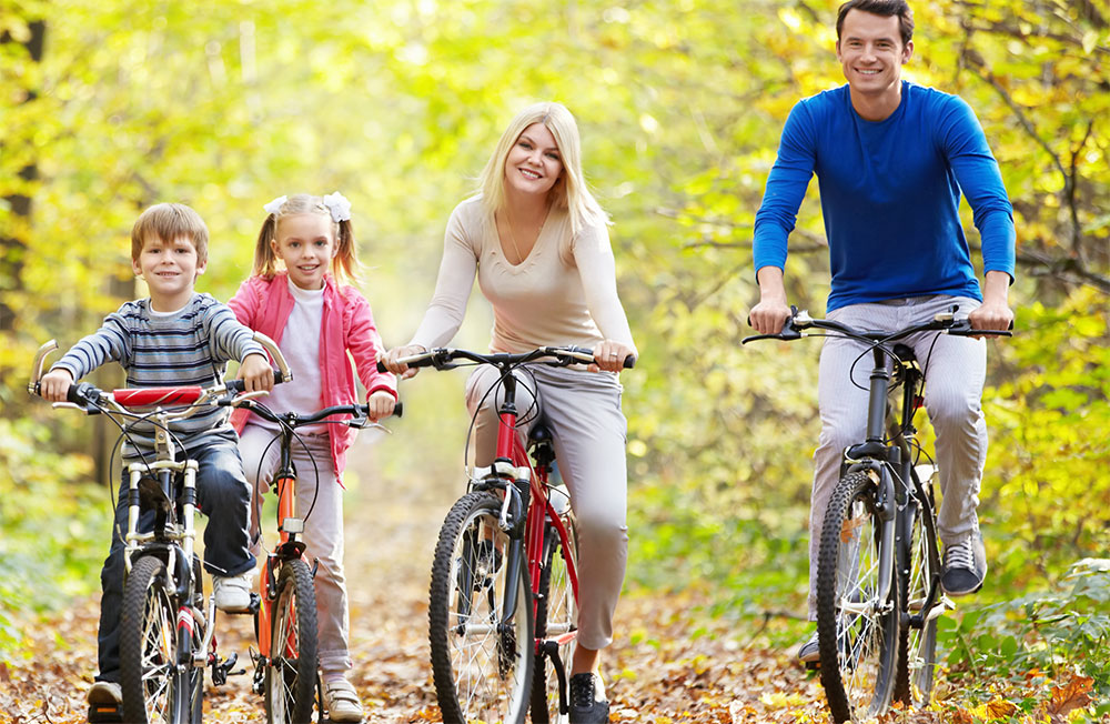 Happy family cycling outdoor